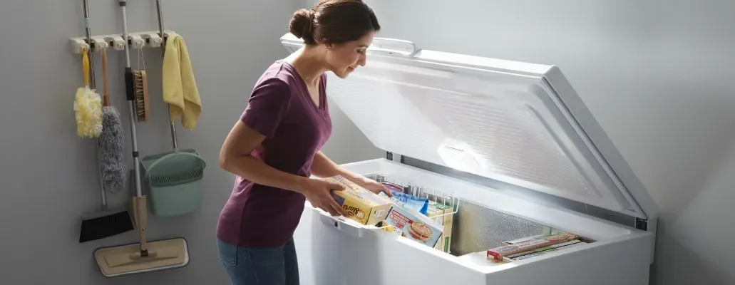 woman opening deep freezer